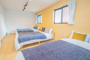 Postel nebo postele na pokoji v ubytování LA CHIC StyleHakata 1 - Vacation STAY 71385v
