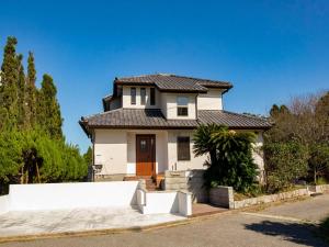 a white house with a black roof at Isumi seishinso - Vacation STAY 84726v in Isumi