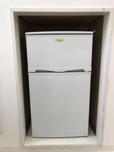 a white refrigerator with its door open in a room at Riverside Plaza Matoba - Vacation STAY 71967v in Kawagoe