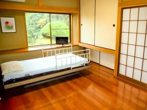a hospital room with a bed and a window at Isumi seishinso - Vacation STAY 84726v in Isumi +83 photos