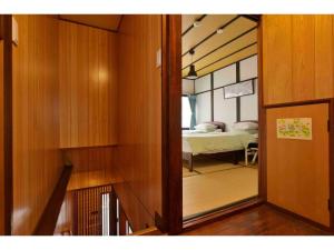 En eller flere senge i et værelse på Konpeitou House - Vacation STAY 11969