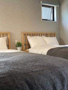 Giường trong phòng chung tại Côte terrasse onomichi - Vacation STAY 92432v