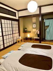 a room with two large beds in a room at Mitsuba House- Vacation STAY 12196 in Annaka