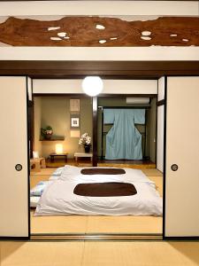 a large bedroom with a large bed in it at Mitsuba House- Vacation STAY 12196 in Annaka