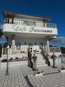 a white building with a sign that readseat panama at Cafe panorama - Vacation STAY 96734v in Esumi