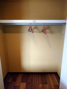 a closet with two hangers on the wall at MAHALO - Vacation STAY 05296v in Saikai