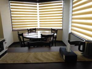 a table and chairs in a room with a window at Guest House Jinya - Vacation STAY 05308v in Takayama
