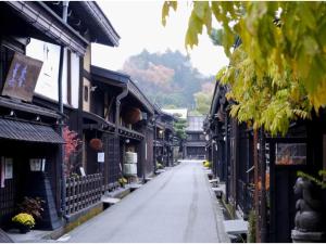 an empty street in an asian town with buildings at Guest House Jinya - Vacation STAY 05308v in Takayama