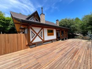 a house with a wooden deck in front of it at Akagi Log INN Glamping - Vacation STAY 39479v in Shibukawa