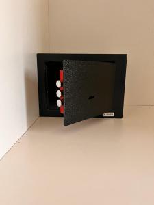 a black box with red and white balls in it at La Casetta del Vicolo in La Spezia