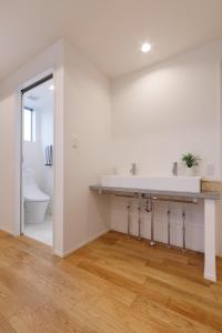 a bathroom with a sink and a toilet at SEASIDE TERRACE SUN - Vacation STAY 12430 in Numazu