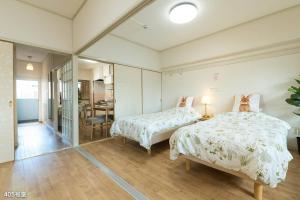 Ένα ή περισσότερα κρεβάτια σε δωμάτιο στο Nanei Building - Vacation STAY 47399v