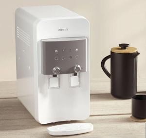 a white coffee maker sitting on a table with a cup at Seraya Sweet Home in Alor Setar