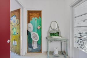 a bathroom with a toilet and a mirror at Encantadora casa con terraza y parking en Figueres in Figueres +13 photos