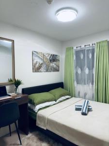 Postel nebo postele na pokoji v ubytování Cozy Corner - One Spatial Iloilo