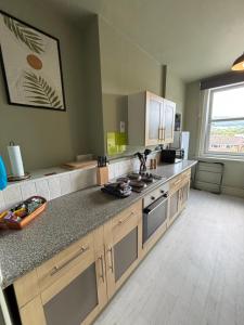 a kitchen with a counter and a sink and a stove at Church Stretton Shropshire Hills in Church Stretton +17 photos