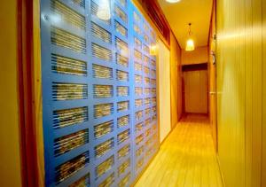 a hallway with a blue wall withktop at Guest house Icyaribacyoude - Vacation STAY 09894v in Naha