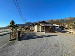 a small house on the side of a road at Hakusyu - Vacation STAY 11460v in Aso