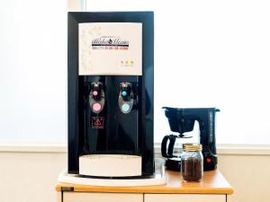 a coffee maker sitting on top of a table at El Sol Town OKINAWA - Vacation STAY 12494 in Chatan