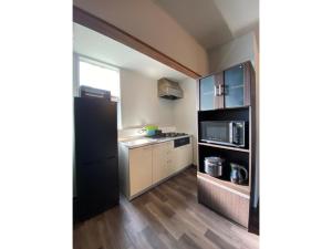 Køkken eller tekøkken på Trust Maison Kitagawa 303 - Vacation STAY 13430v