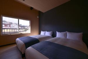 Giường trong phòng chung tại Toki kūkan Izumi - Vacation STAY 13184v