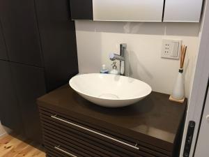 a bathroom with a white bowl sink on a counter at Minshuku Kakutani Hitohira - Vacation STAY 16023v in Wada +13 photos