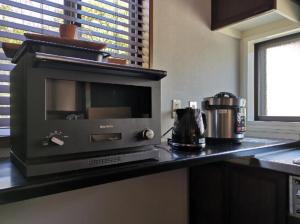 a microwave on a counter in a kitchen at Ahouse - Vacation STAY 17245v in Takashima