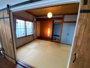 an open door to a room with a large floor at Poroto Base - Vacation STAY 18129v in Shiraoi