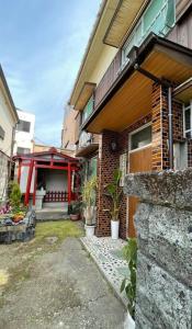 a brick building with a door and a porch at Hotaru no Yado - Vacation STAY 24964v in Sumoto