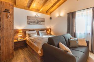 Katil atau katil-katil dalam bilik di Dorfchalets - Chalet Lausi inkl Tauern Spa Eintritt & Sommerkarte