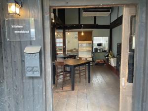 a dining room and kitchen with a table and chairs at base sanablend - Vacation STAY 37429v in Kyotango