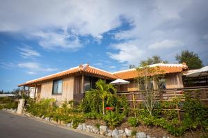 a house with a fence in front of it at Villa Muse Okinawa- Vacation STAY 43827v in Nago