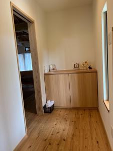 a room with a wooden counter and a mirror at The Villa with a YAMAHA C6X - Villa Muse Okinawa- Vacation STAY 43827v in Nago +16 photos