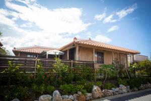 a house with a fence in front of it at Villa Muse Okinawa- Vacation STAY 43823v in Nago