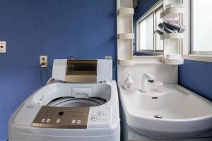 a bathroom with a washing machine next to a sink at VIILENT KUJUKURI Ocean1 - Vacation STAY 33286v in Kujukuri +93 photos