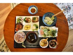 a table with a tray of different types of food at Minshuku Otaki fireplace - Vacation STAY 46344v in Miyaki