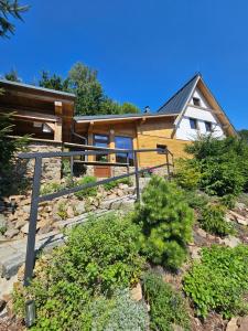 a house with a stone path in front of it at JIROTOVY BOUDY II in Telnice
