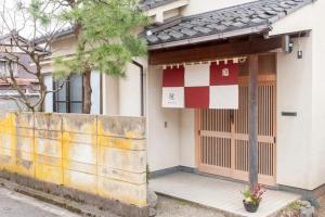 a building with a checkered sign in front of it at WABI - Vacation STAY 52963v in Kanazawa