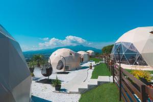 a row of luxury tents with mountains in the background at Blissful Garden - Vacation STAY 46374v in Shibukawa