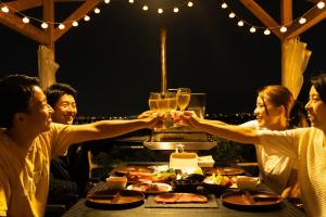 a group of people holding up their glasses at a table at Blissful Garden - Vacation STAY 46374v in Shibukawa