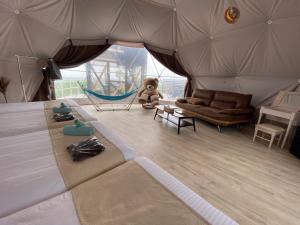 a room with a bed and a teddy bear in a tent at Blissful Garden - Vacation STAY 46330v in Shibukawa