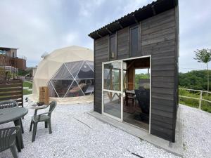 a small house with a tent in the background at Blissful Garden - Vacation STAY 46330v in Shibukawa