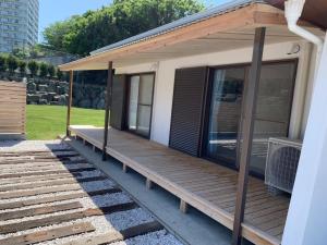 a house with a wooden porch with glass doors at Takeshima - Vacation STAY 61918v in Naruto