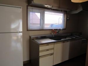 a small kitchen with a sink and a refrigerator at Villa Le Port - Vacation STAY 61630v in Abuta