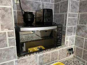 a microwave sitting on a shelf in a bathroom at Elegance Kukou Minami B - Vacation STAY 12934 in Miyazaki +21 photos