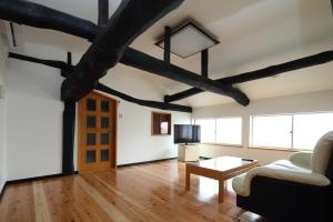 a living room with a couch and a table at Higashichichibu-mura Kominka - Vacation STAY 59627v in Minano