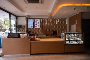 a restaurant with a counter with a food counter at Devin Otel in Isparta