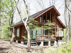 a log cabin in the woods with trees at Runesu Karuizawa - Vacation STAY 92239v in Tsumagoi +11 photos