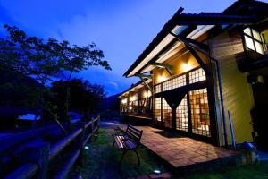 a bench sitting outside of a building at night at TABIHAKU STAY Kasumi - Vacation STAY 70463v in Kami