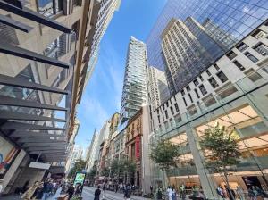 a view of a city street with tall buildings at Sydney CBD Top level 2 bedroom Condo with amazing view Pool Gym 3 in Sydney